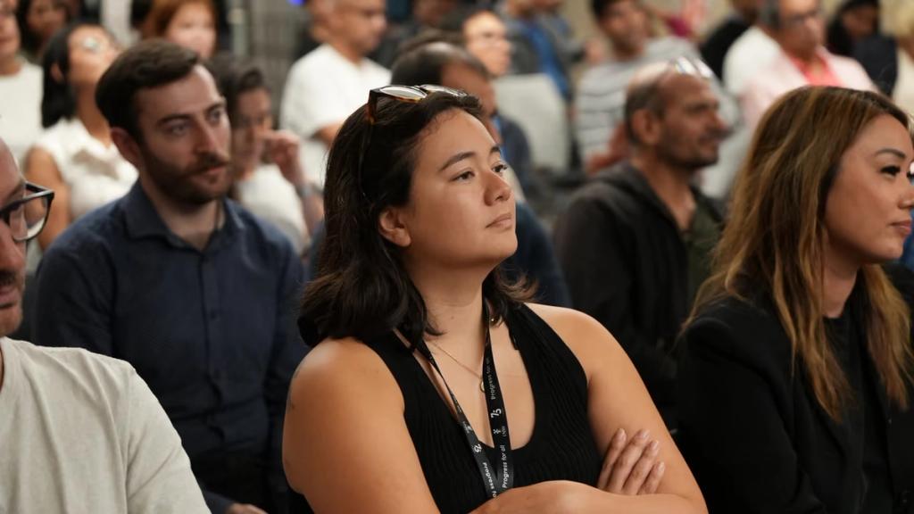 Attendees watching a presentation.