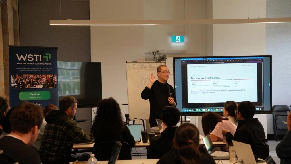 A facilitator walking the room through an exercise on the big screen.