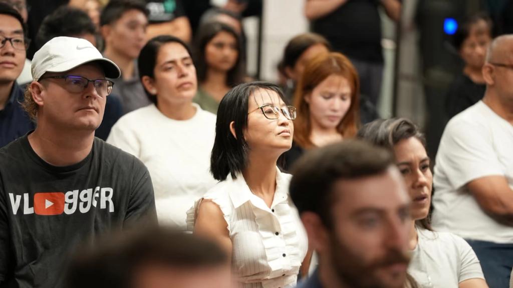 Attendees following a talk from the middle of the room.