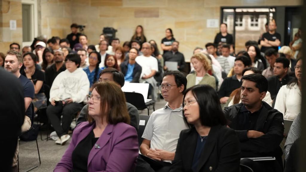 A packed hall of attendees.