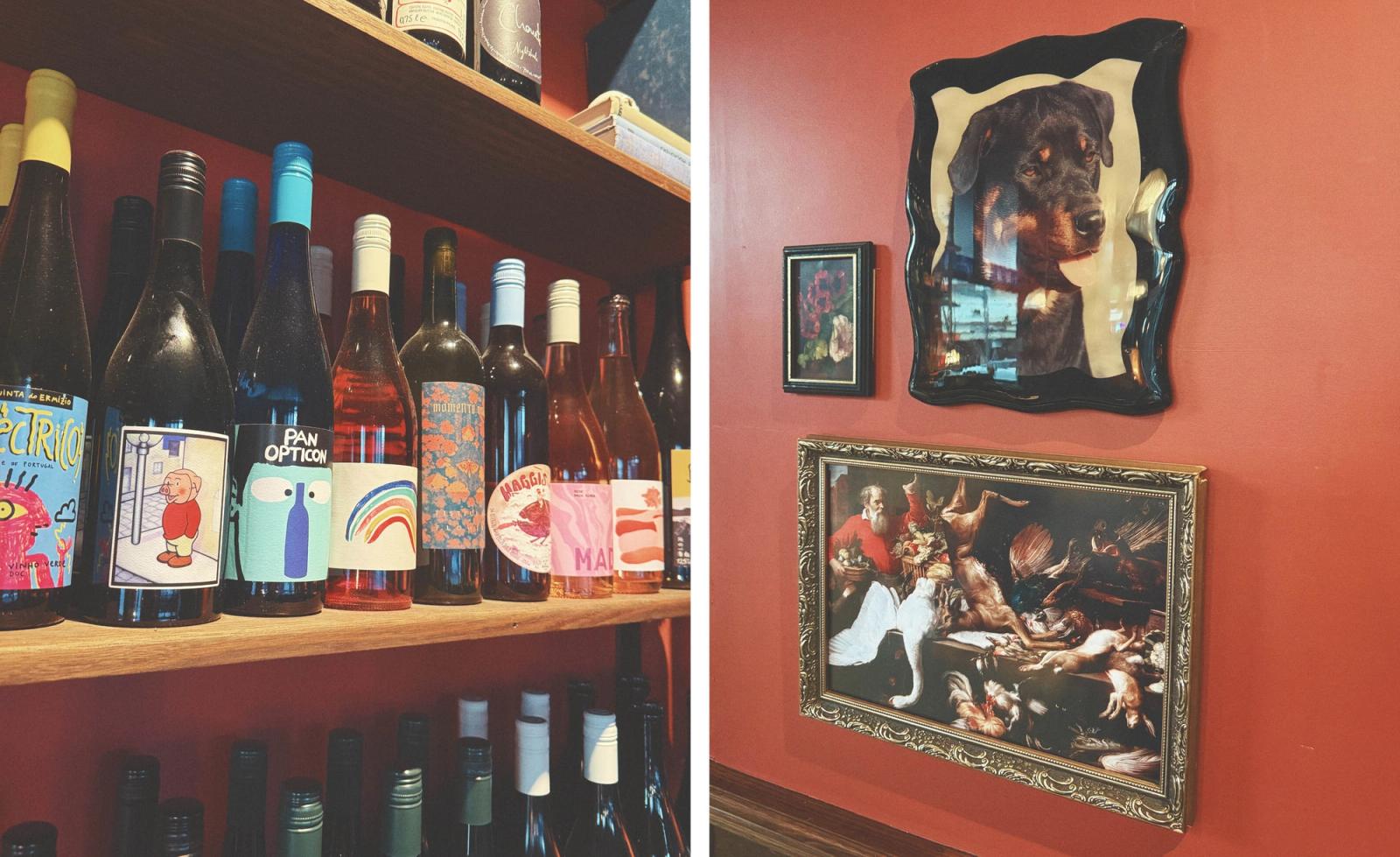 Two scenes from Peaches wine bar on High Street in Thornbury: on the left, a close-up of natural wine bottles lined up on a warm timber shelf, their boldly illustrated labels featuring cartoon characters, rainbows, abstract creatures and playful graphic motifs in a vivid array of colours; on the right, an eclectic gallery wall on a deep terracotta-painted surface featuring an ornate gilt-framed Flemish-style hunting still life painting, a small dark-framed floral portrait, and a dramatic oversized photograph of a Rottweiler in a wavy black frame, capturing the irreverent and distinctly characterful personality of this much-loved neighbourhood wine bar.