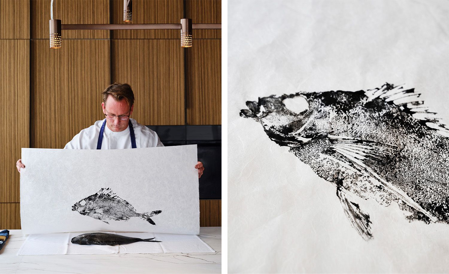 Two images of Pipit chef Ben Devlin practising gyotaku, the traditional Japanese art of fish printing: on the left, Ben in his white chef's jacket and blue apron holding up a large sheet of washi paper bearing a striking black ink impression of a whole fish, the actual fish resting on the marble bench before him beneath warm timber pendant lighting; on the right, a close-up of the resulting gyotaku print revealing extraordinary detail in the scales, fins and eye of the fish rendered in dramatic black ink on textured white paper, capturing the intersection of culinary philosophy, artistic practice and deep reverence for the ocean's produce that defines Ben Devlin's approach at Pipit.