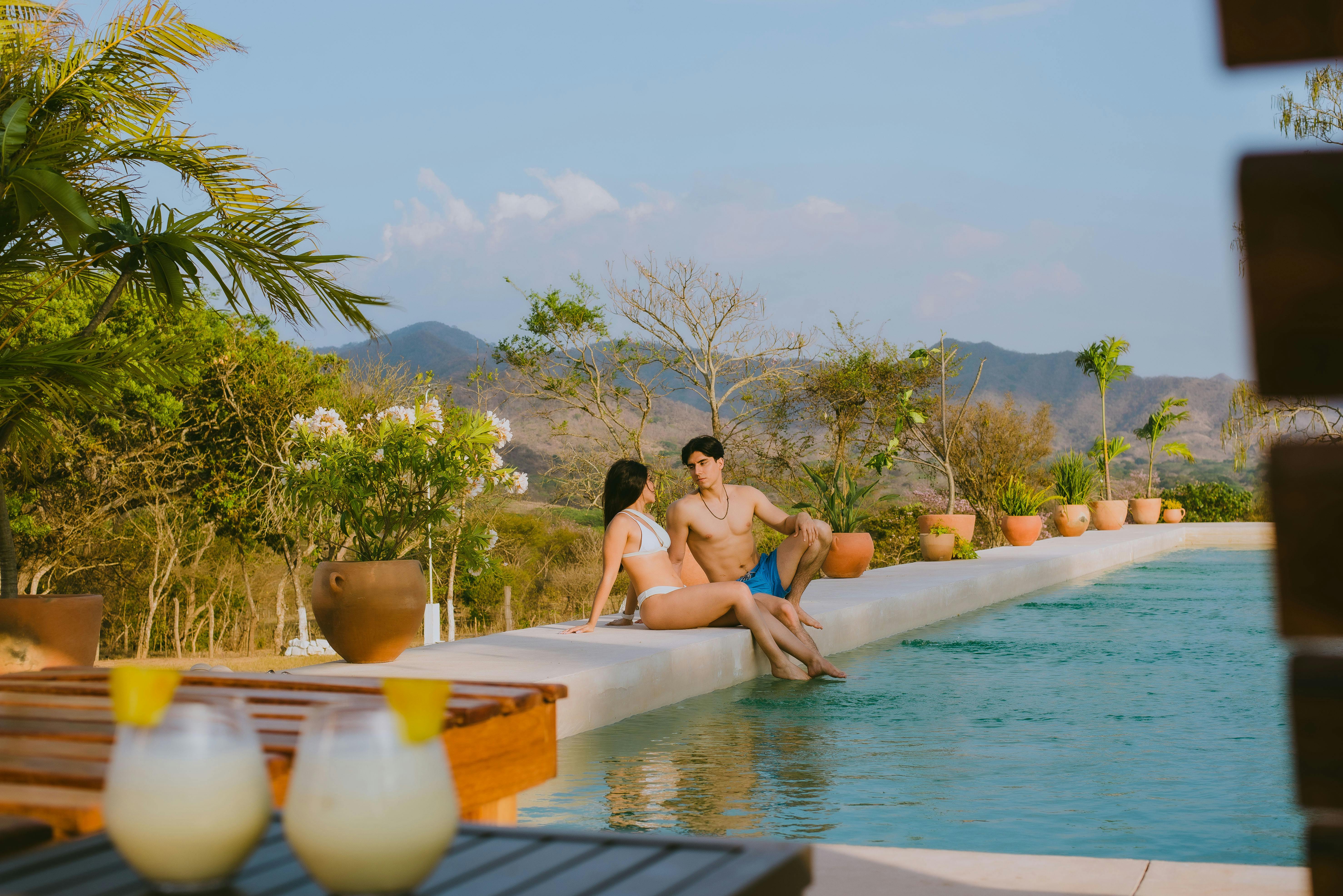 Couple relaxing by pool