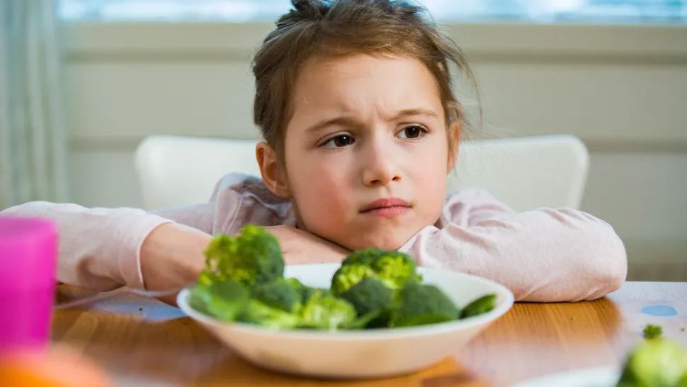 Child fed up with being forced to eat vegetables