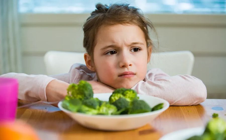 Child fed up with being forced to eat vegetables