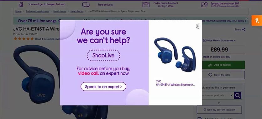 Curry's UK product page for wireless earphones, partially blocked by an intrusive live chat pop-up