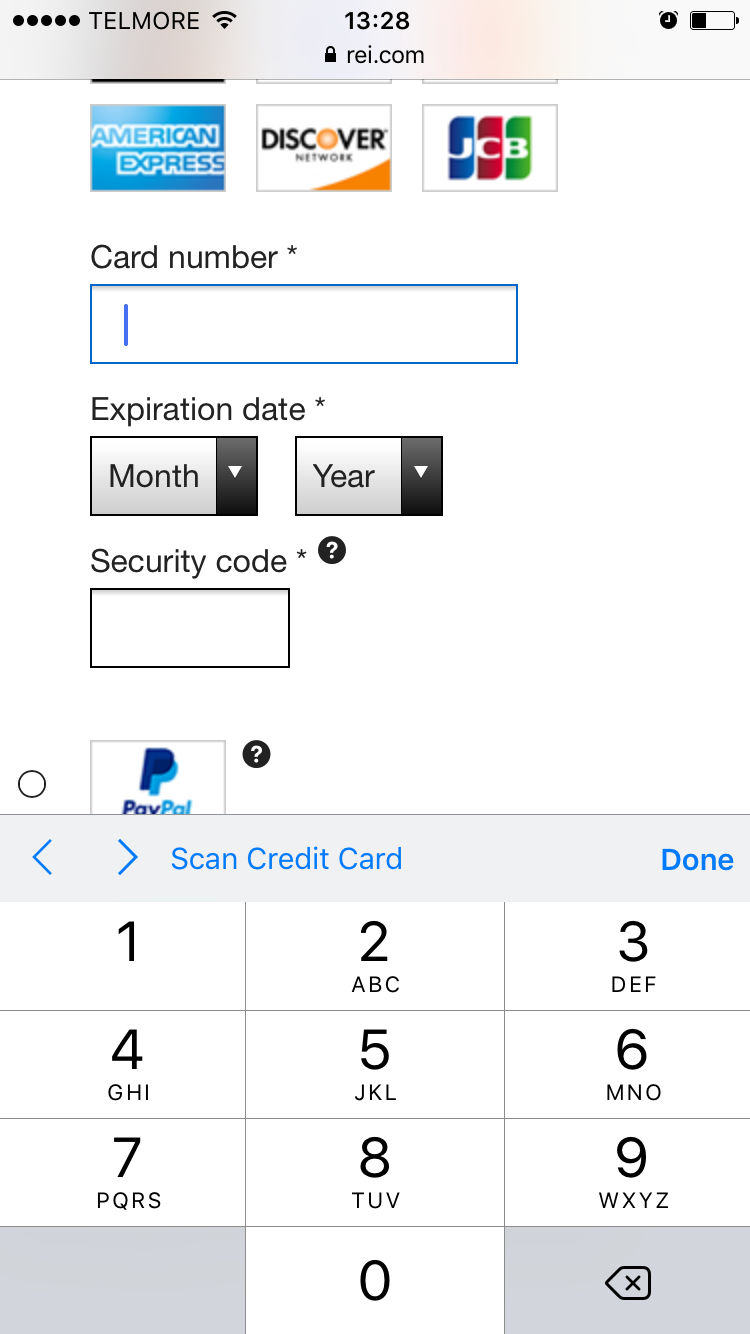 Credit card input field on the REI checkout, with a numerical iOS keyboard