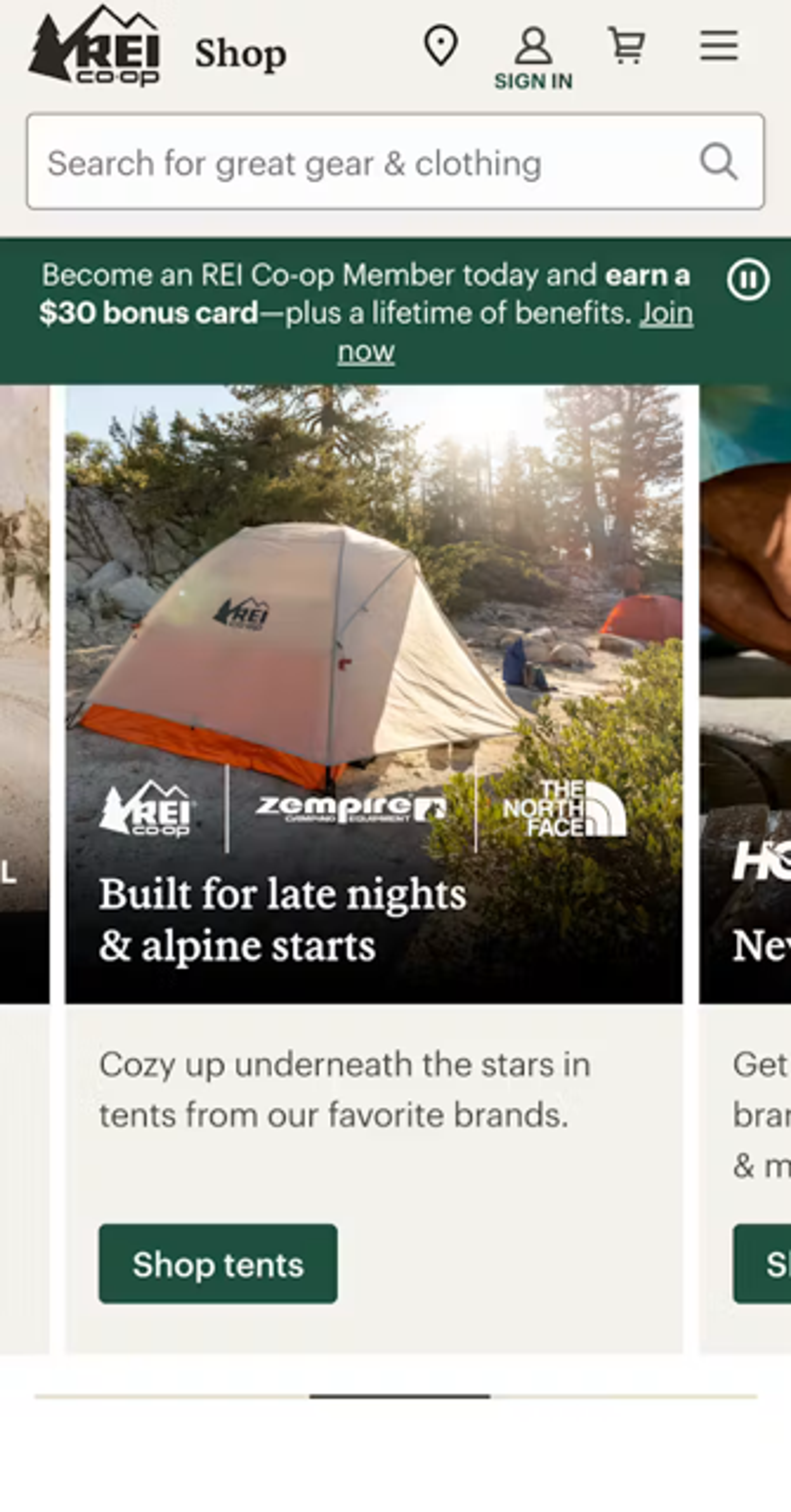 REI mobile homepage with prominent banner UI element