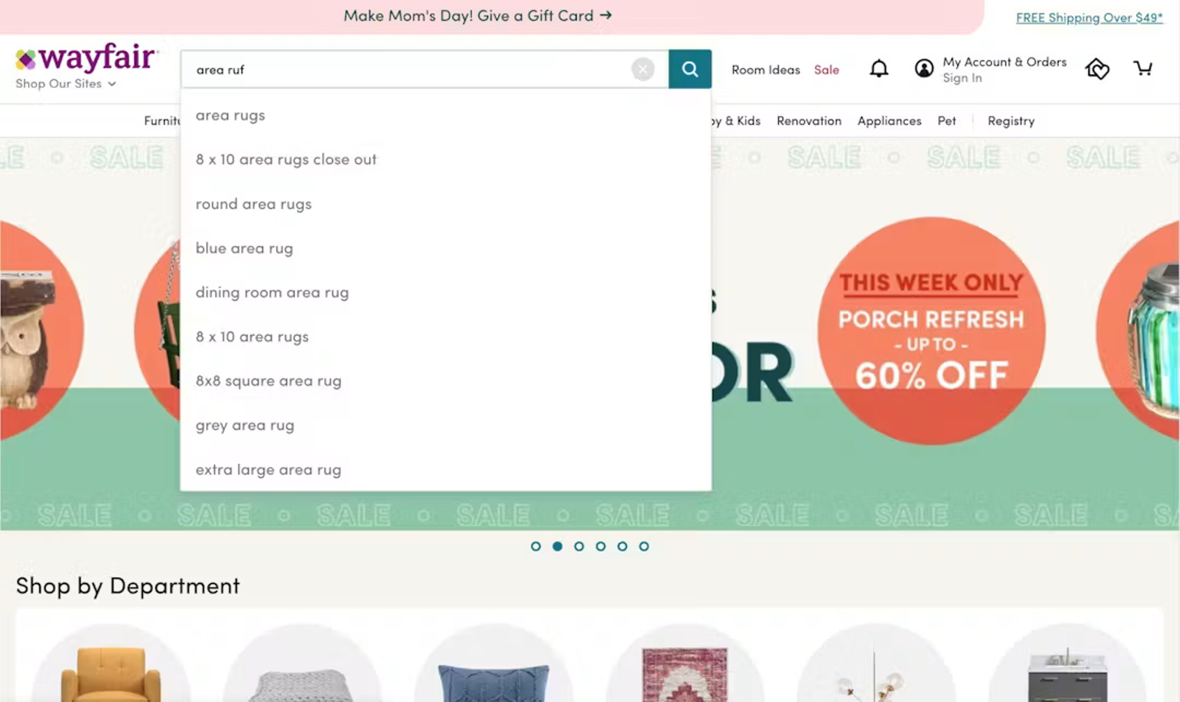 Wayfair homepage showing a user searching for area rugs, with accurate autocomplete suggestions shown despite the user making a typo ("ruf" instead of "rug)