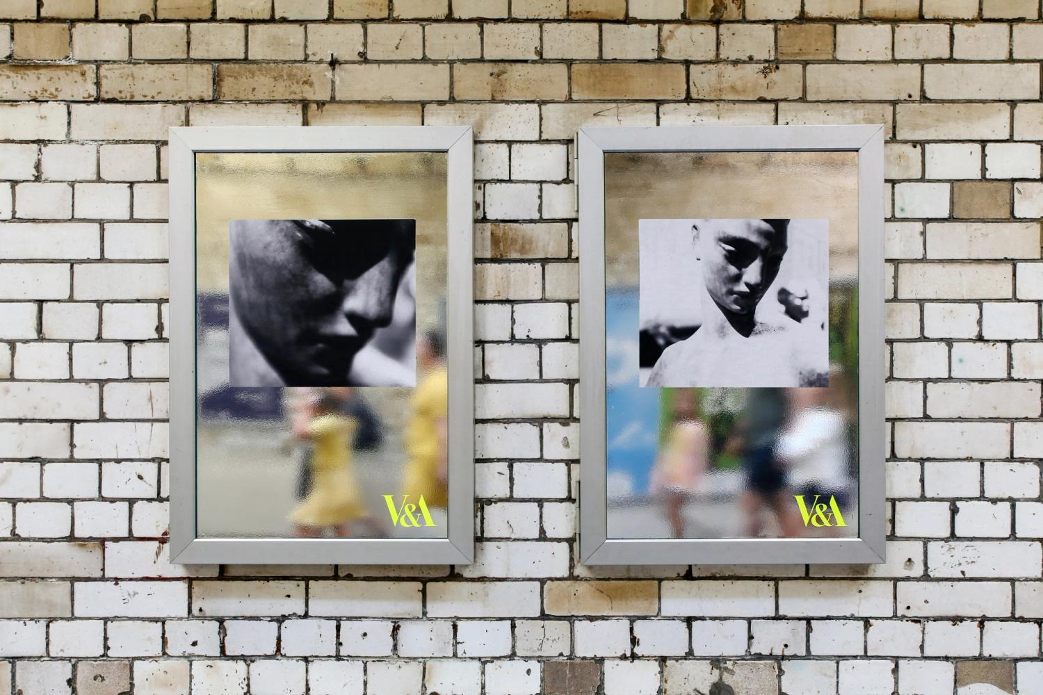 Photograph of silver posters in South Kensington V&A tunnel with images of two black and white sculptures