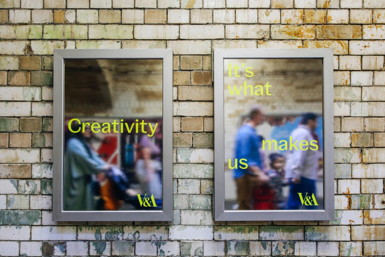 Two V&A posters in subway frames on a brick wall. Text reads "Creativity" and "It's what makes us" in yellow letters.