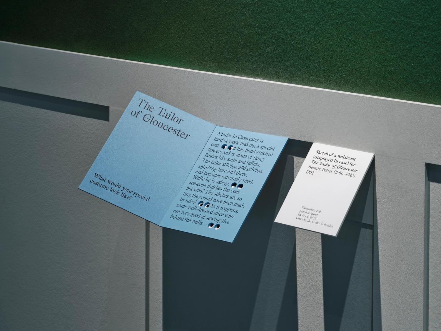 A photograph of two small interpretation panels in a gallery space