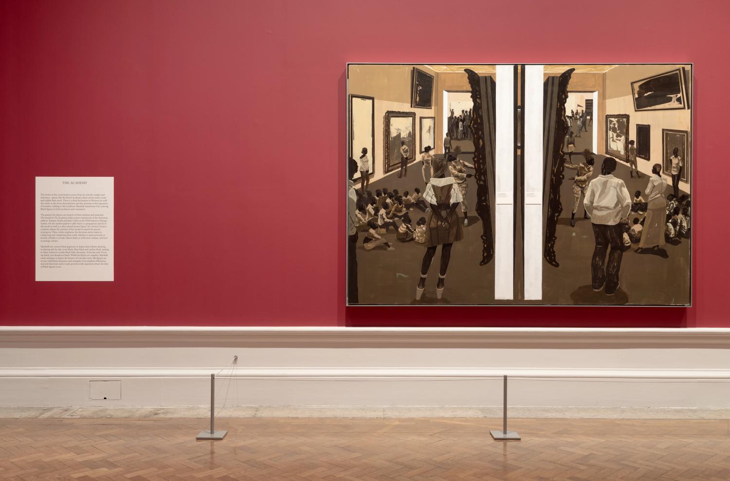 Painting on red wall with a museum scene, figures in browns and beiges, and a descriptive text panel to the left.