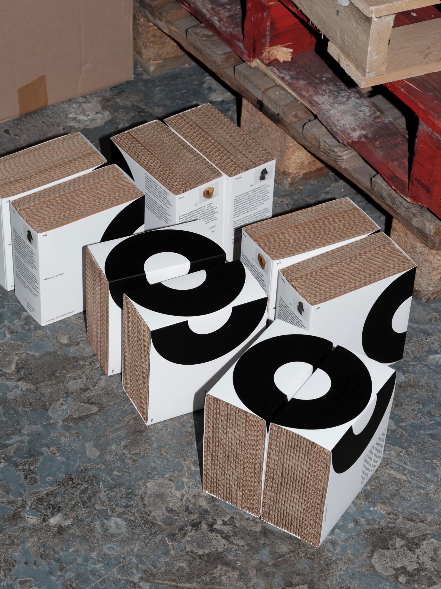 Photograph of scattered Co Projects packaging on a marble floor