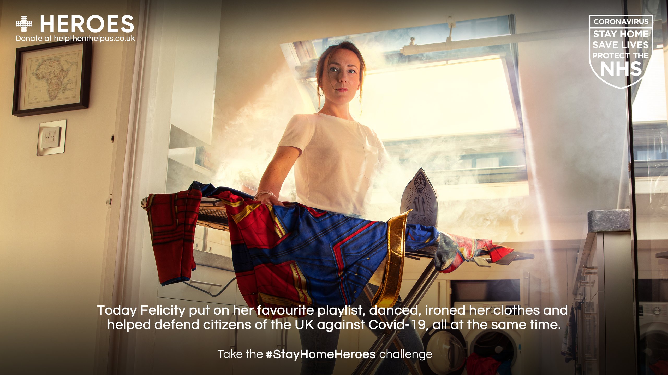 Woman ironing superhero costume in kitchen for Stay Home Heroes lockdown campaign