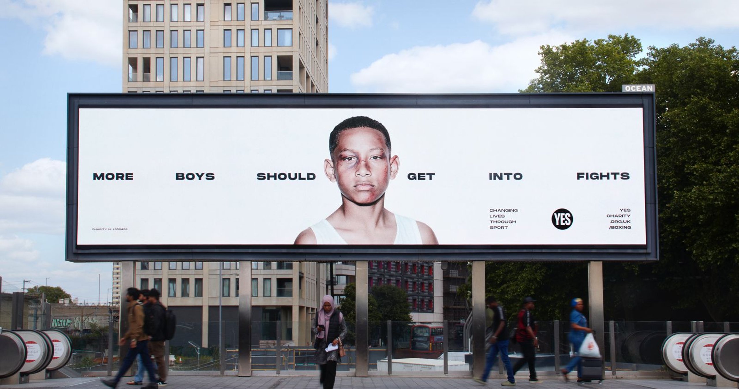 YES! charity billboard on London street showing More Boys Should Get Into Fights campaign