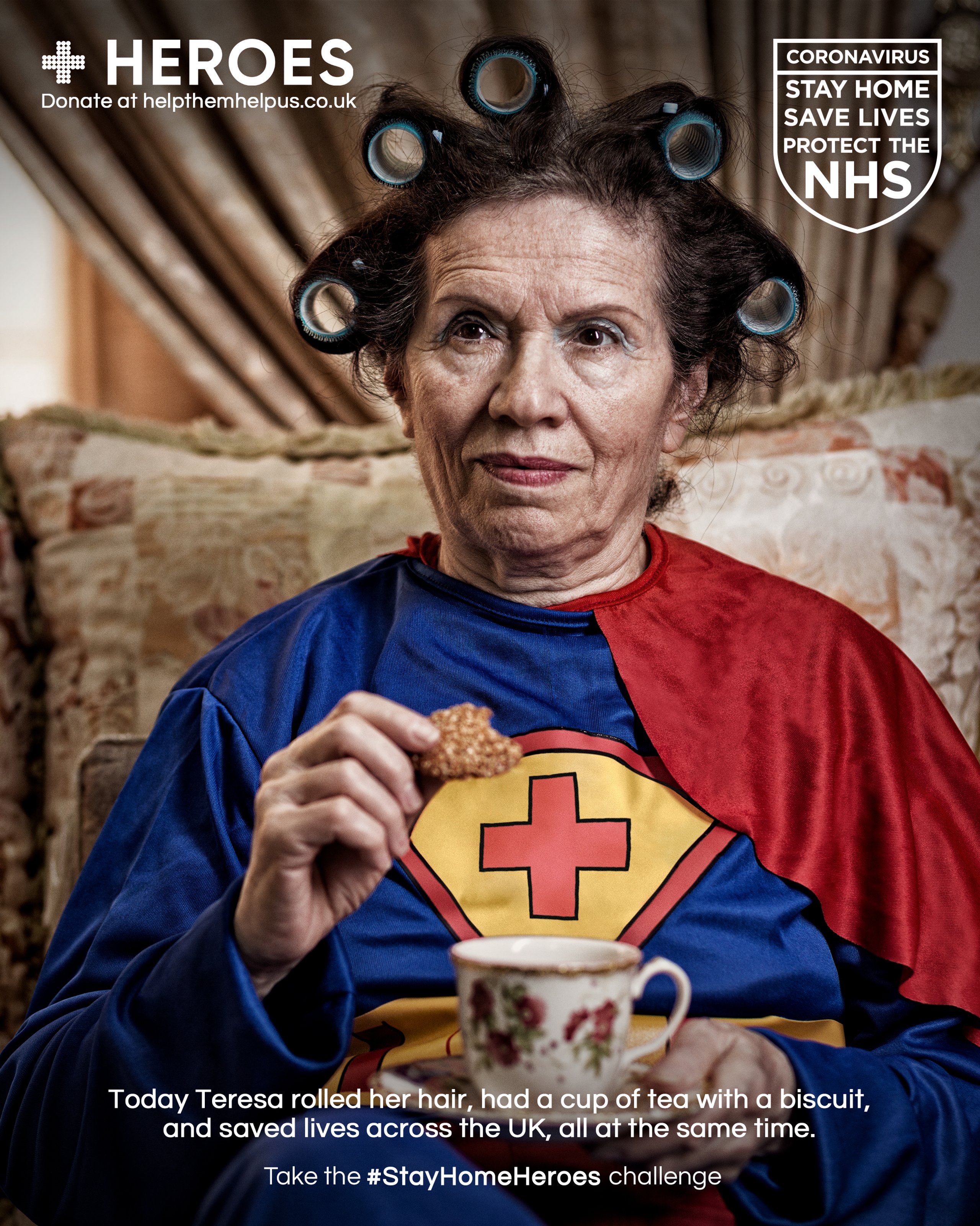 Elderly woman in hair rollers and superhero cape dunking biscuit in tea for Stay Home Heroes