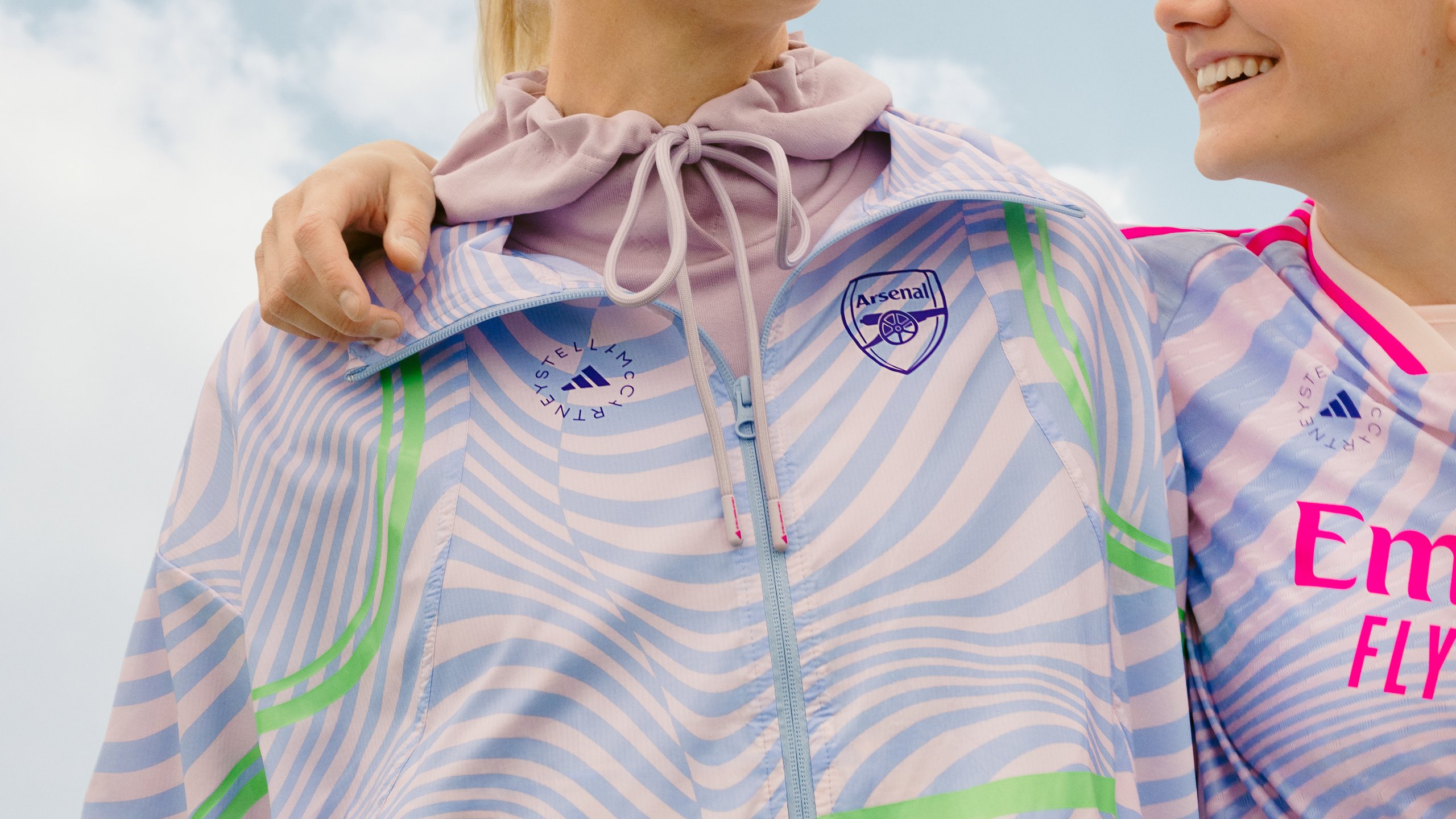 Close-up of adidas by Stella McCartney Arsenal wave-print hooded jacket with Arsenal crest detail