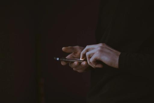 person on mobile - Cronometer vs. Lose It