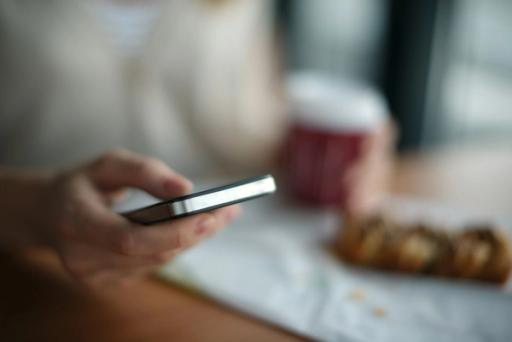 man using phone - Weight Watchers vs Myfitnesspal