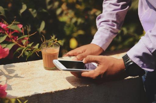 person drinking chai - Lifesum vs MyFitnessPal
