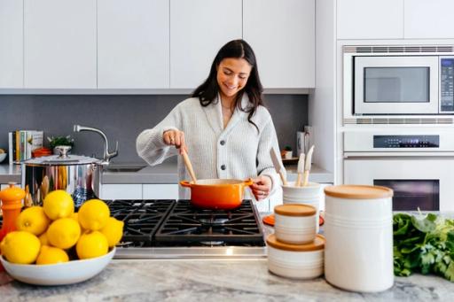 woman making food - How To Measure Calories in Food at Home