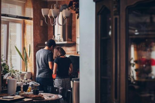 woman cooking with husband - How To Measure Calories in Food at Home