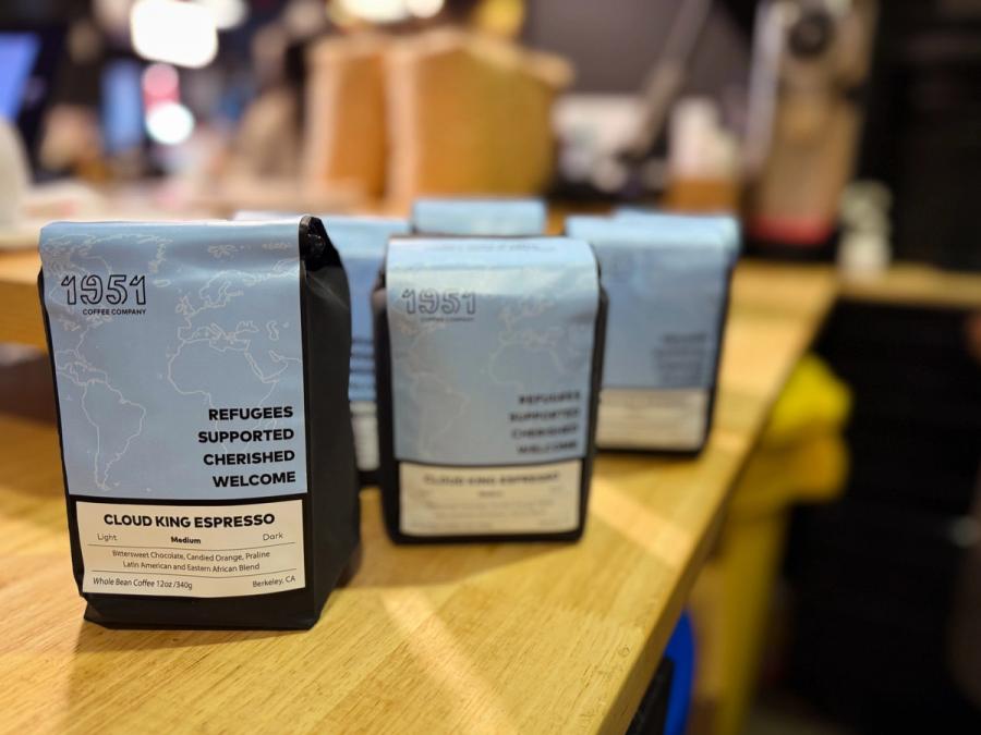 Two 1951 Coffee Company bags of Cloud King Espresso — a Latin American and Eastern African blend roasted in Berkeley, CA — standing on a wooden counter.