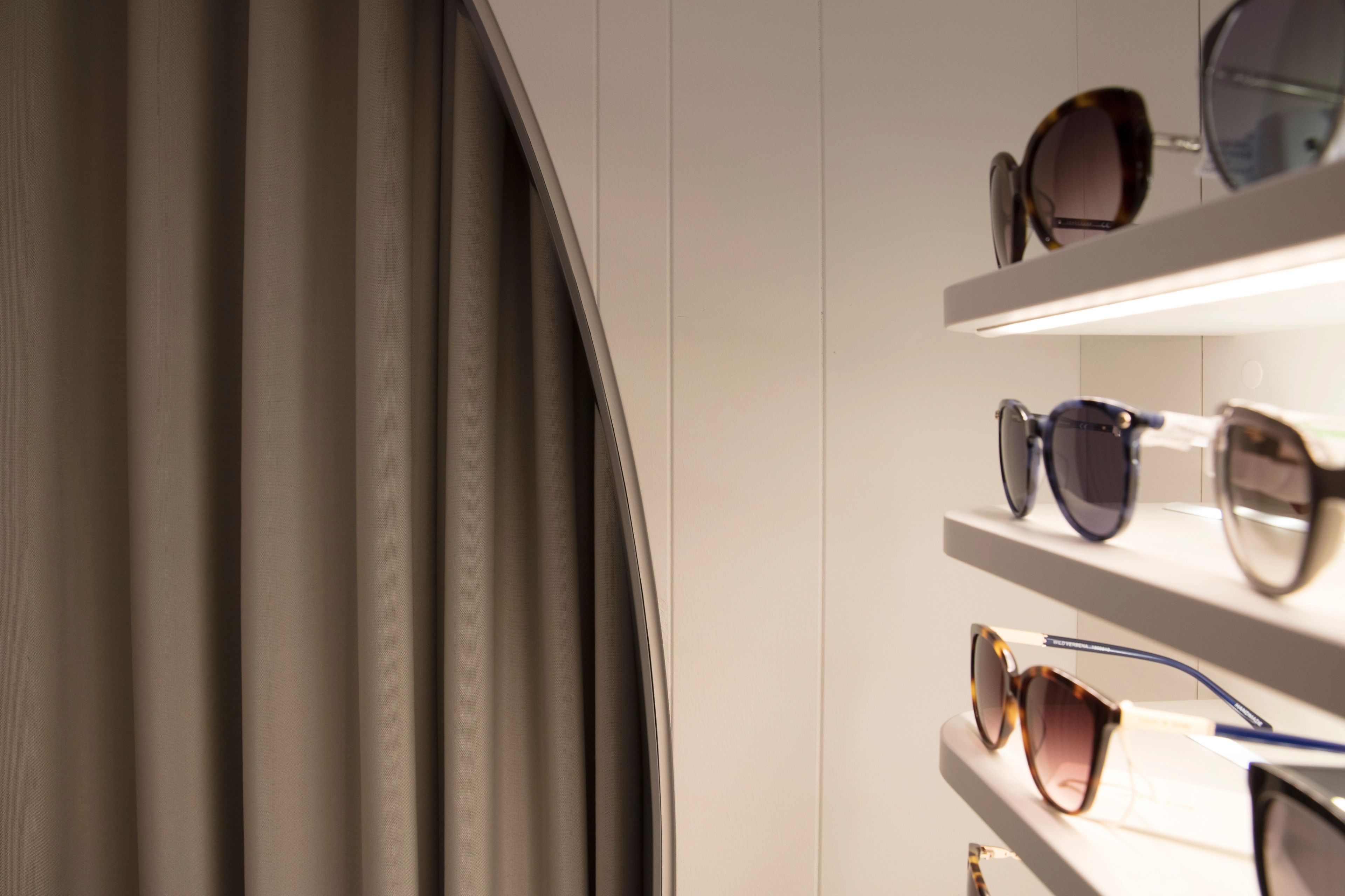 Premium eyewear display at George & Matilda Eye Care, showcasing contemporary retail design and curated optical frames