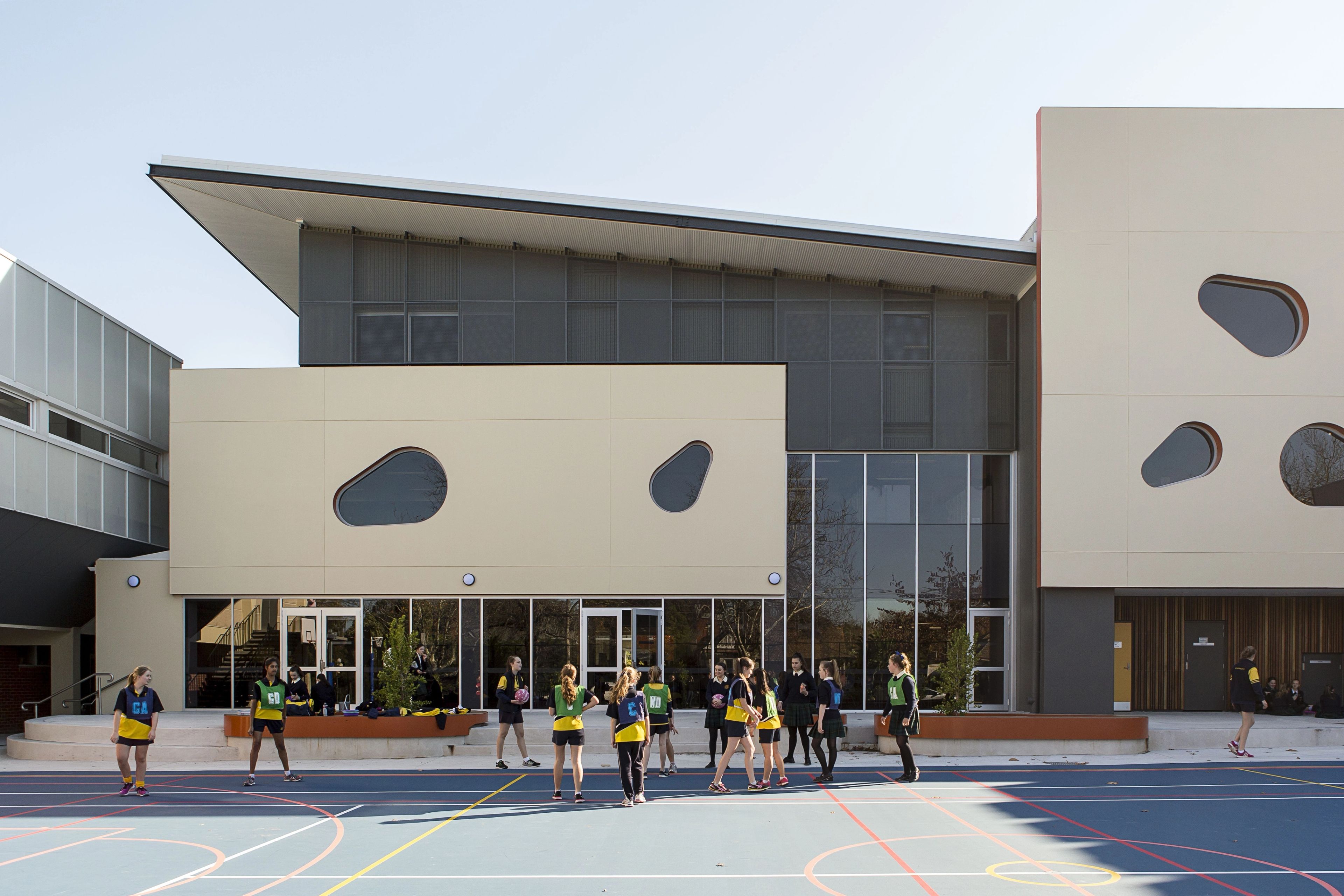 Exterior of the Strathcona Girls Grammar School Learning Centre with students using the landscaped school courtyard.