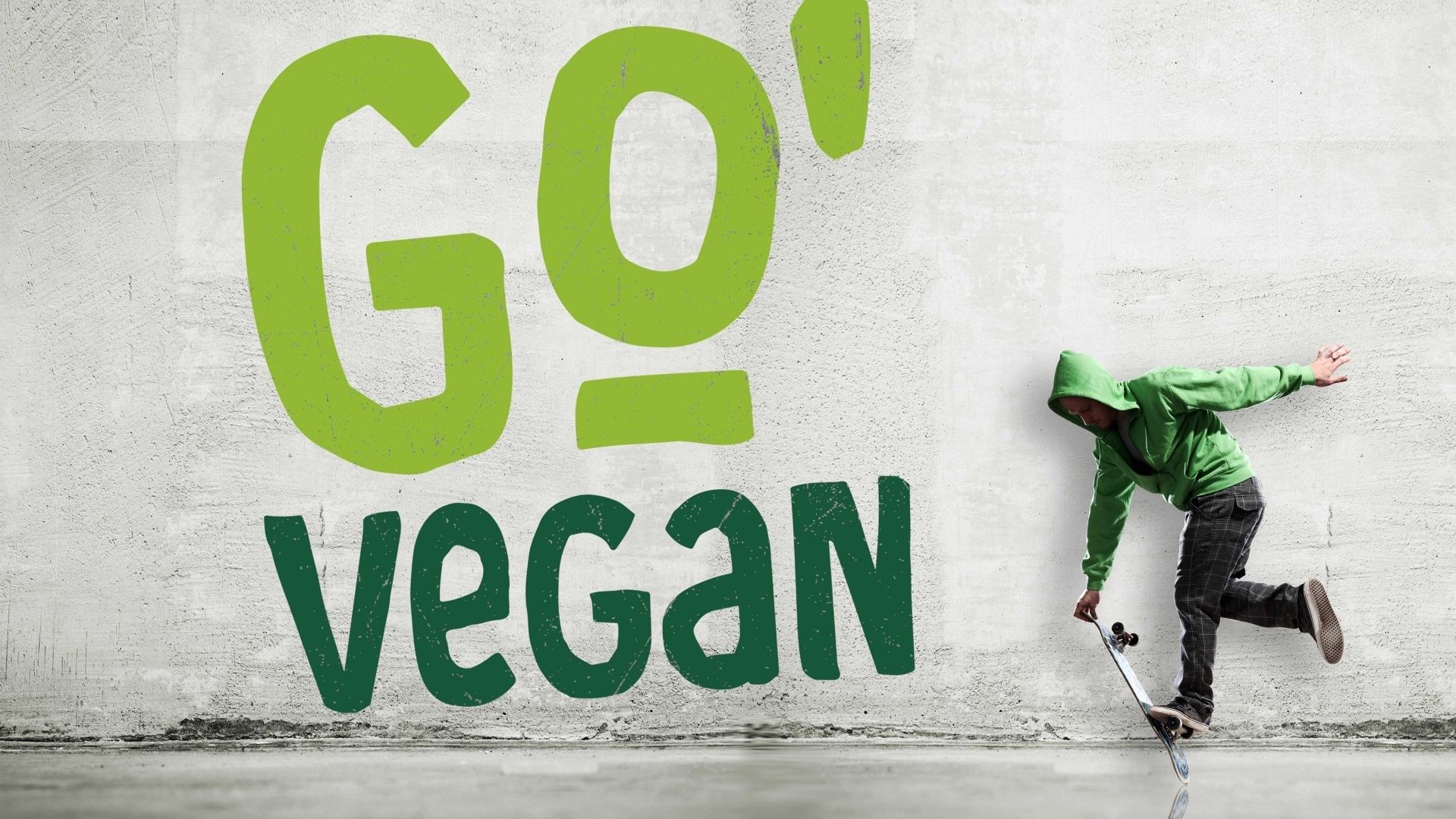 Go vegan logo på vegg og skater