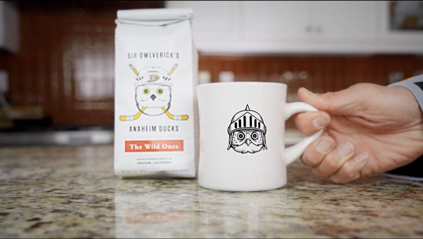 Sir Owlverick's mug held in hand