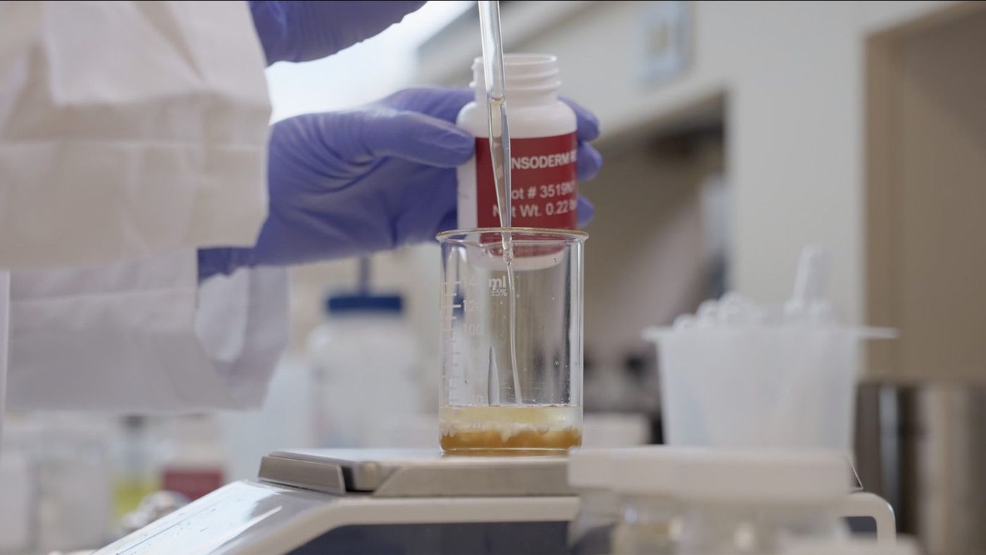 Close-up: chemist hands at work in the lab