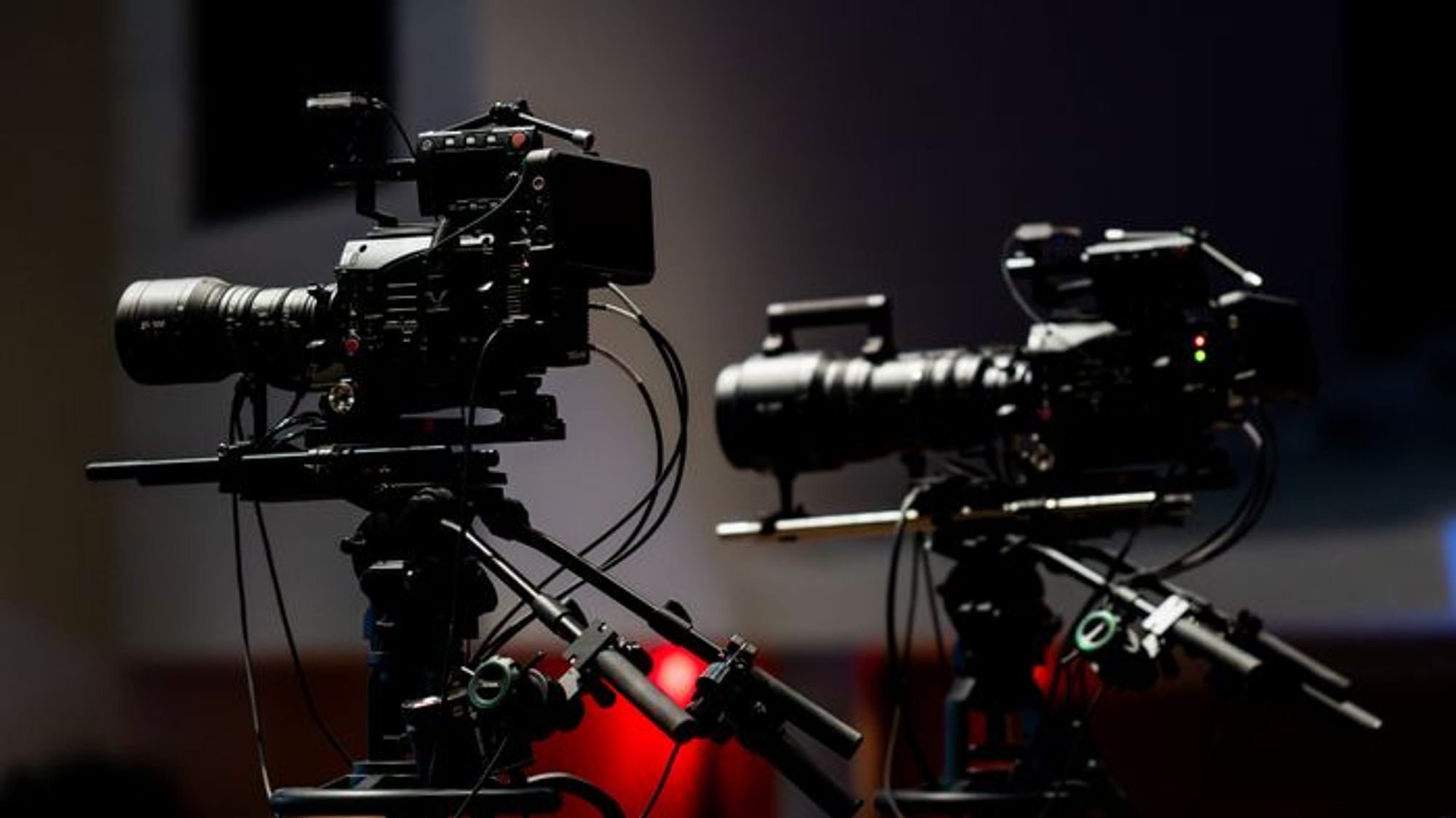 Two rigged cinema cameras set up for a multicam shoot
