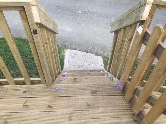 Deck steps with LED lights along the treads