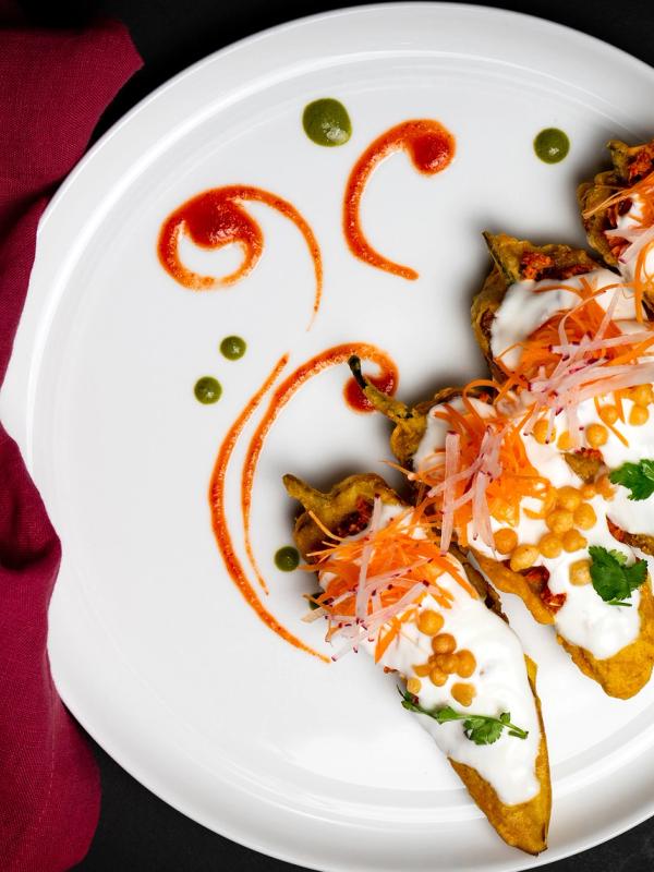 Spicy Railway Peppers featuring crisp peppers tossed with aromatic spices, onions, and herbs in a classic Indian-style preparation.