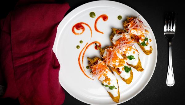 Spicy Railway Peppers featuring crisp peppers tossed with aromatic spices, onions, and herbs in a classic Indian-style preparation.