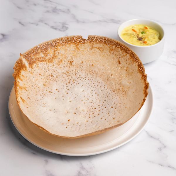 Soft, lacy Kerala appams served with a fragrant coconut-based vegetable stew simmered with aromatic spices.