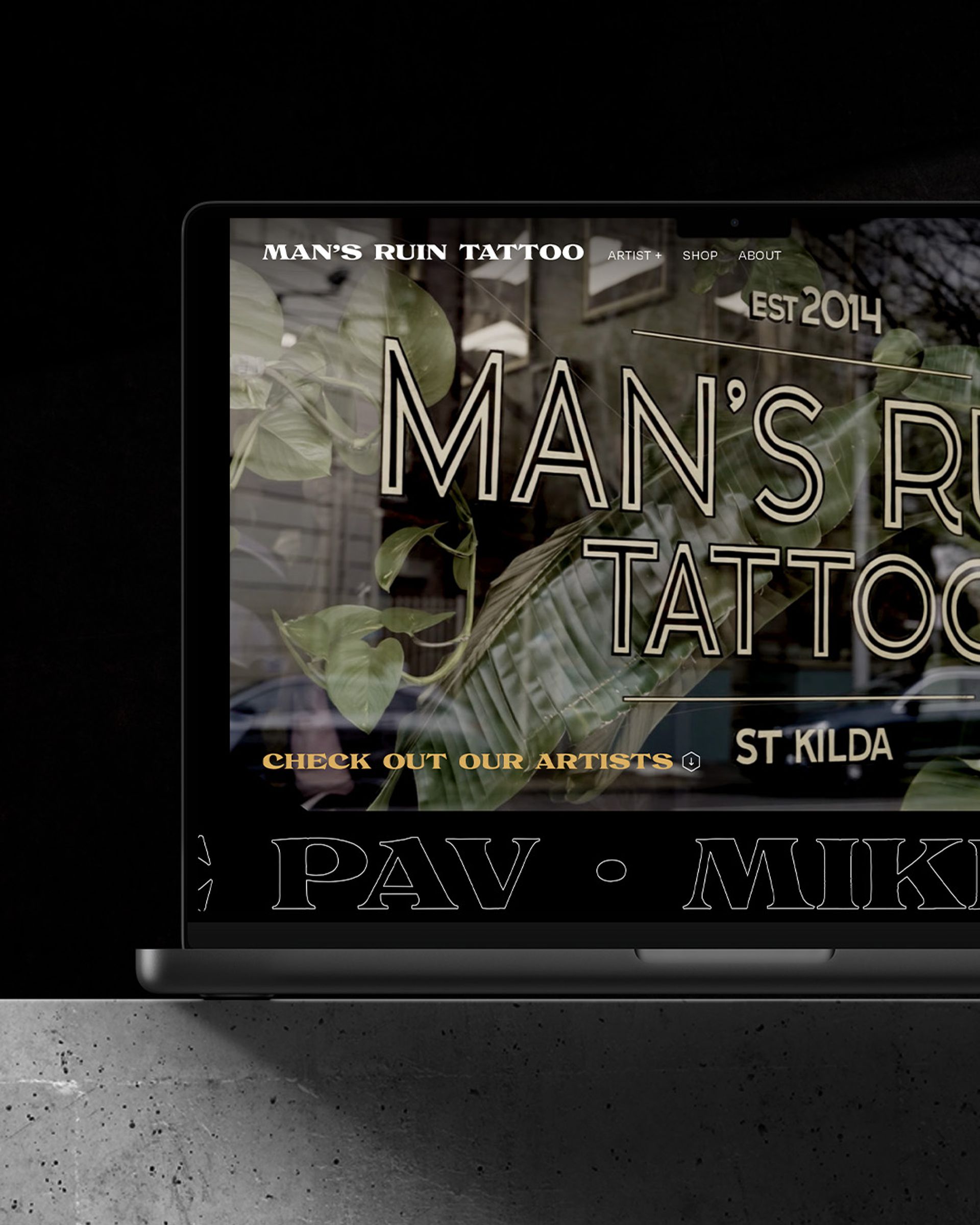 Mans Ruin Tattoo website on macbook