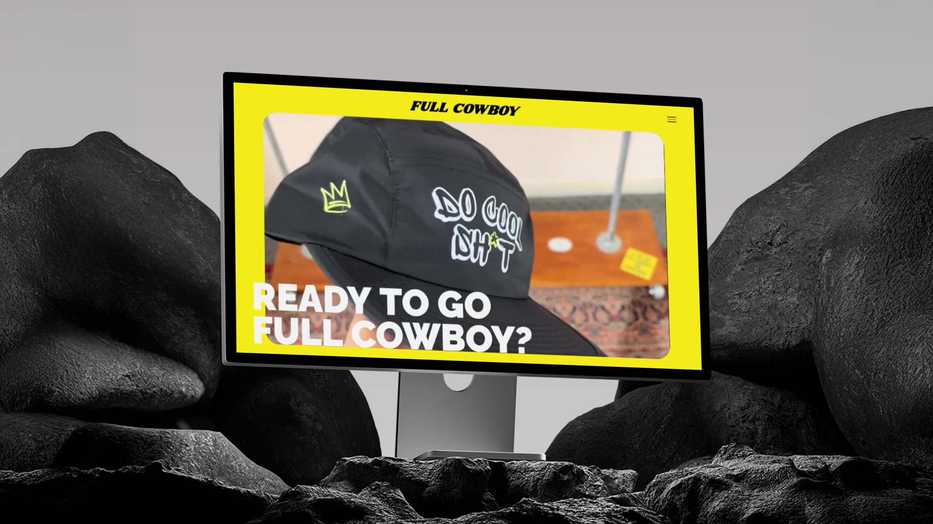 Full Cowboy website mockup on a monitor