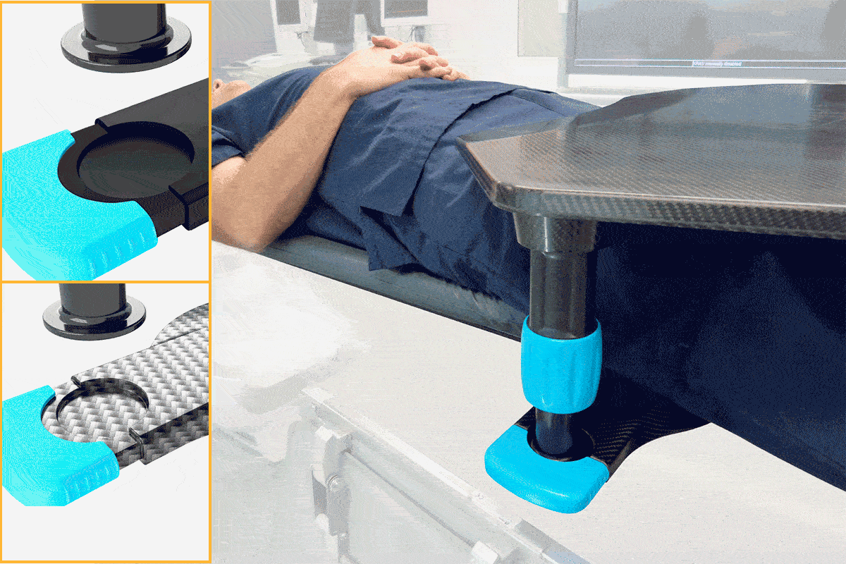 Medical patient with a carbon fiber table secured over their legs by a blue clamp.