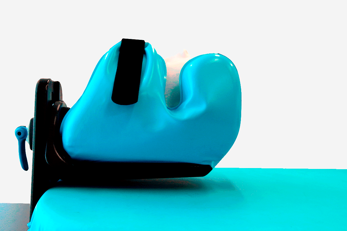 A blue contoured support with a black strap and adjustment lever, mounted on a black frame.