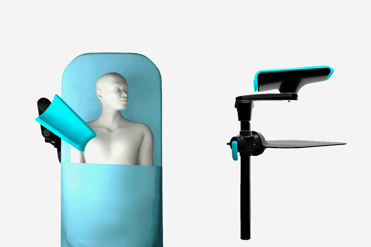 Mannequin on a medical table with a forearm support device, alongside an adjustable stand.