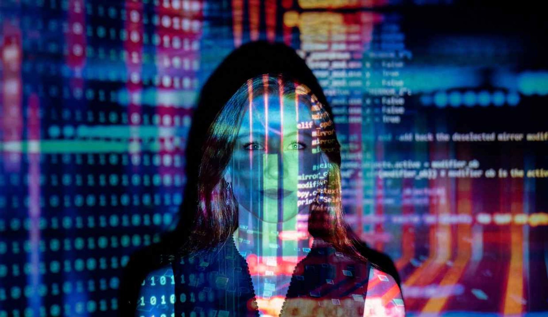Woman looking at screens