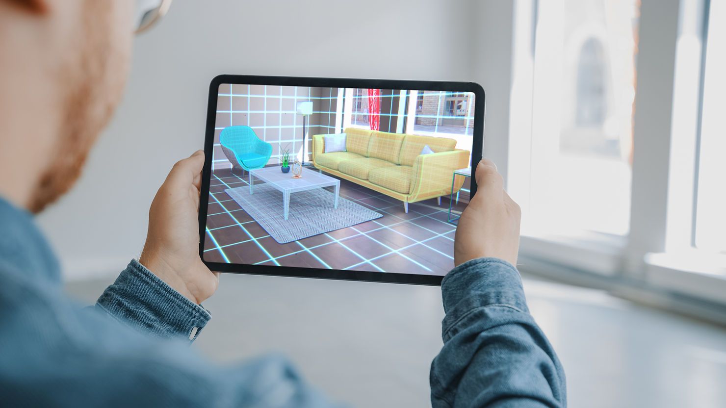 Man holding tablet with AR app