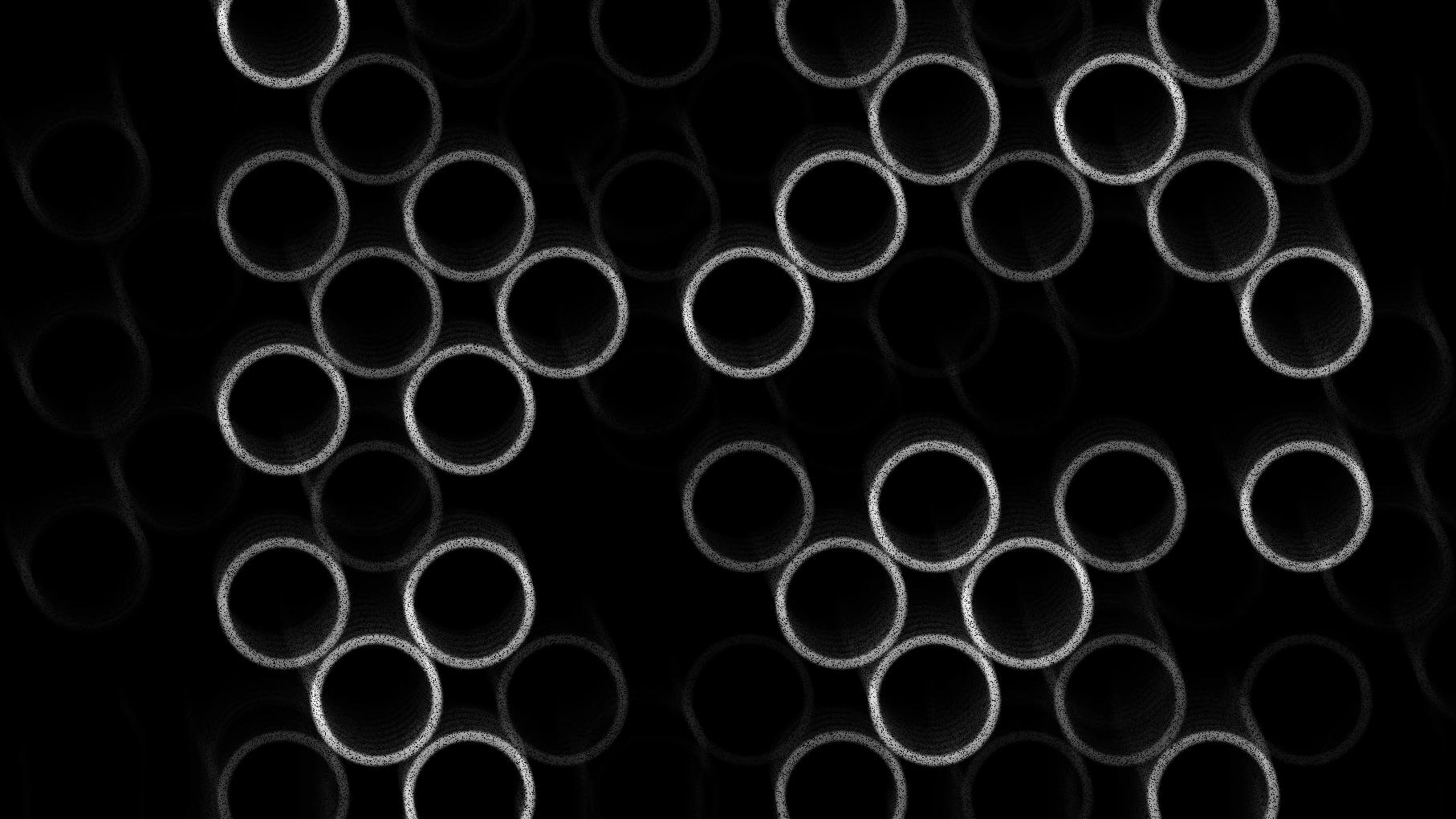 Lots of small white circles next to each other with a black background