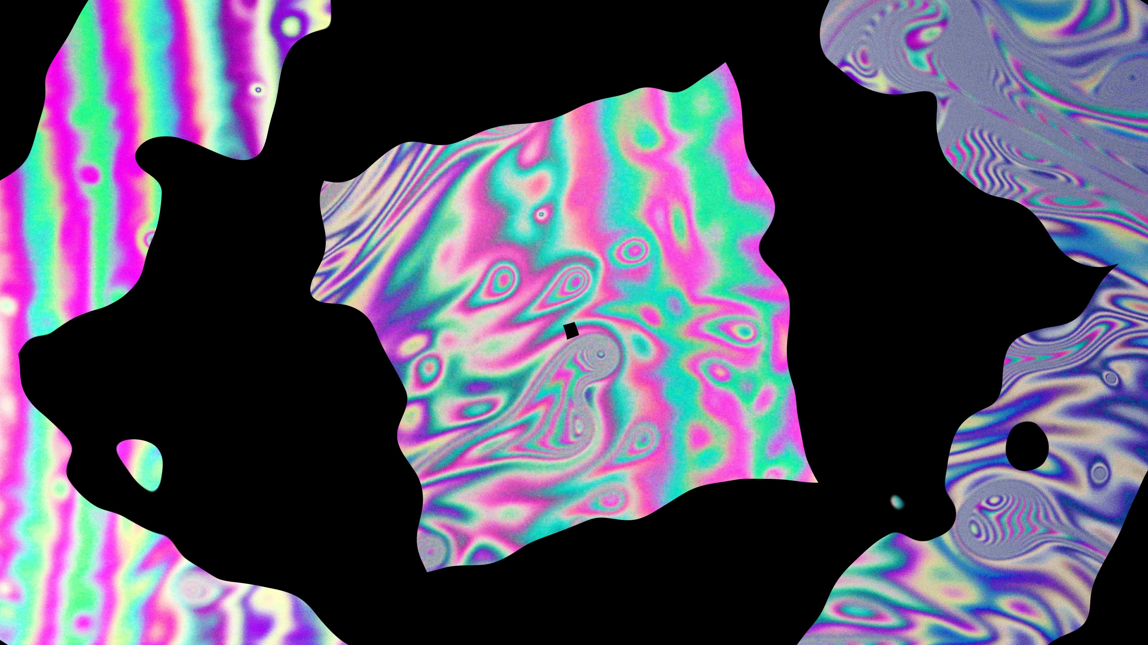 Multicoloured shapes in water with organic shape masks over the top