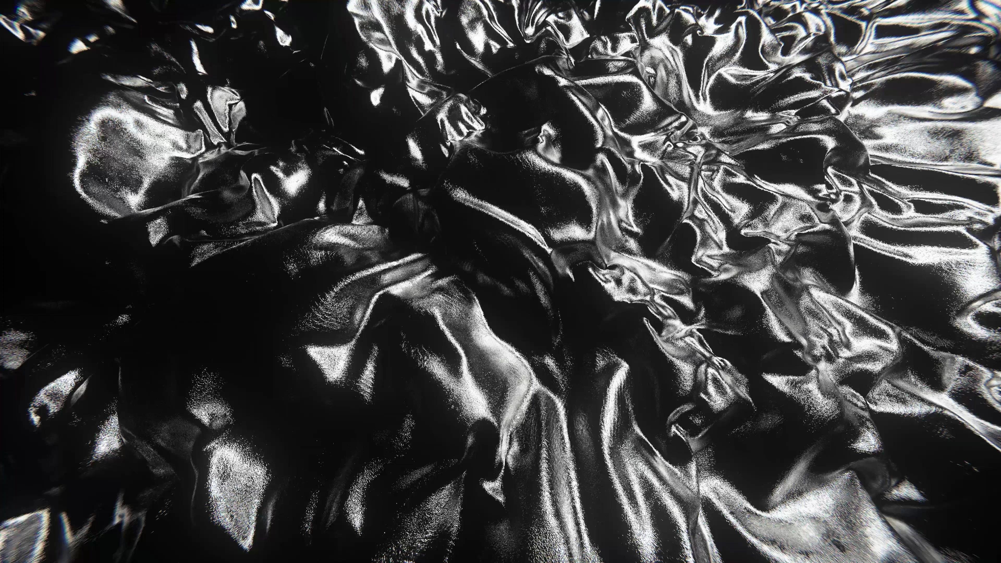 Close-up of a monochromatic, crumpled fabric