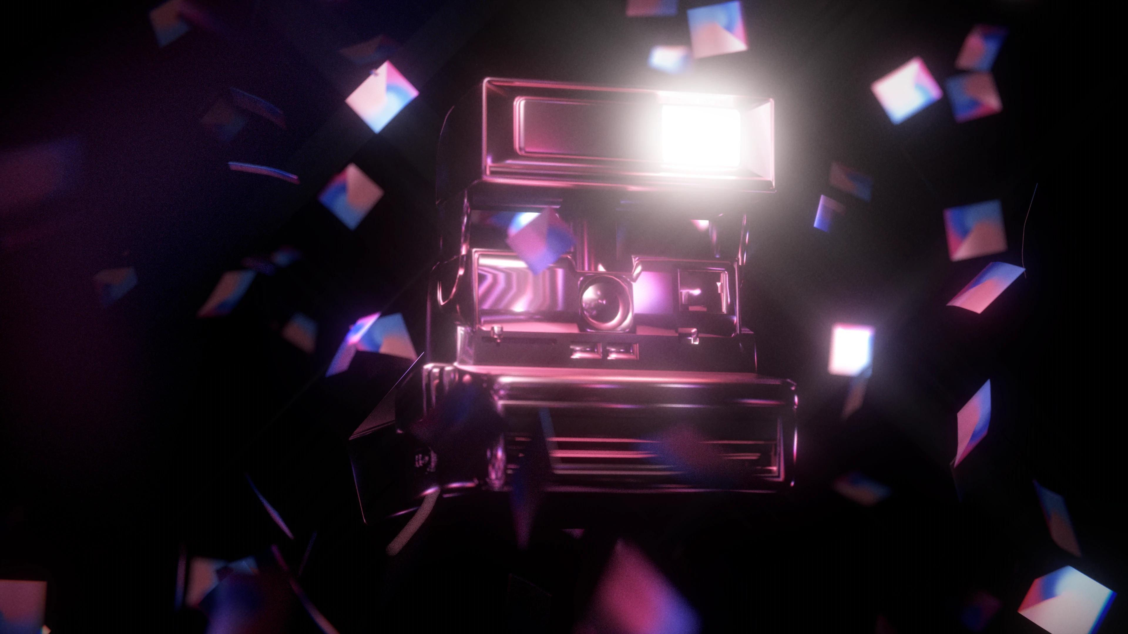 Pink shiny polaroid camera with mini pink and blue prints fluttering around it
