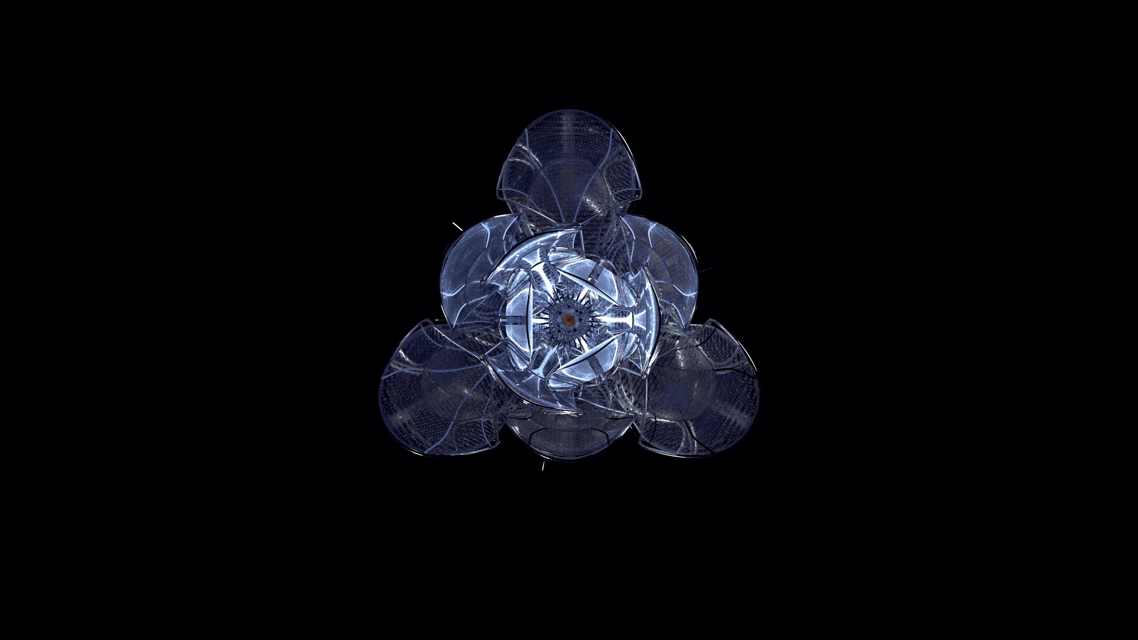 Closed metal flower in middle of pitch black